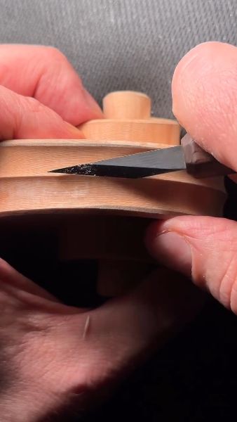 With the chamfer carved, I can extend the fluting to the chamfer line.