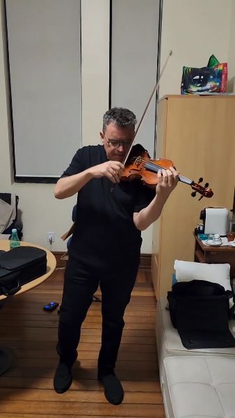 Friend’s joy completing his new violin reflected deep friendship and dedication.